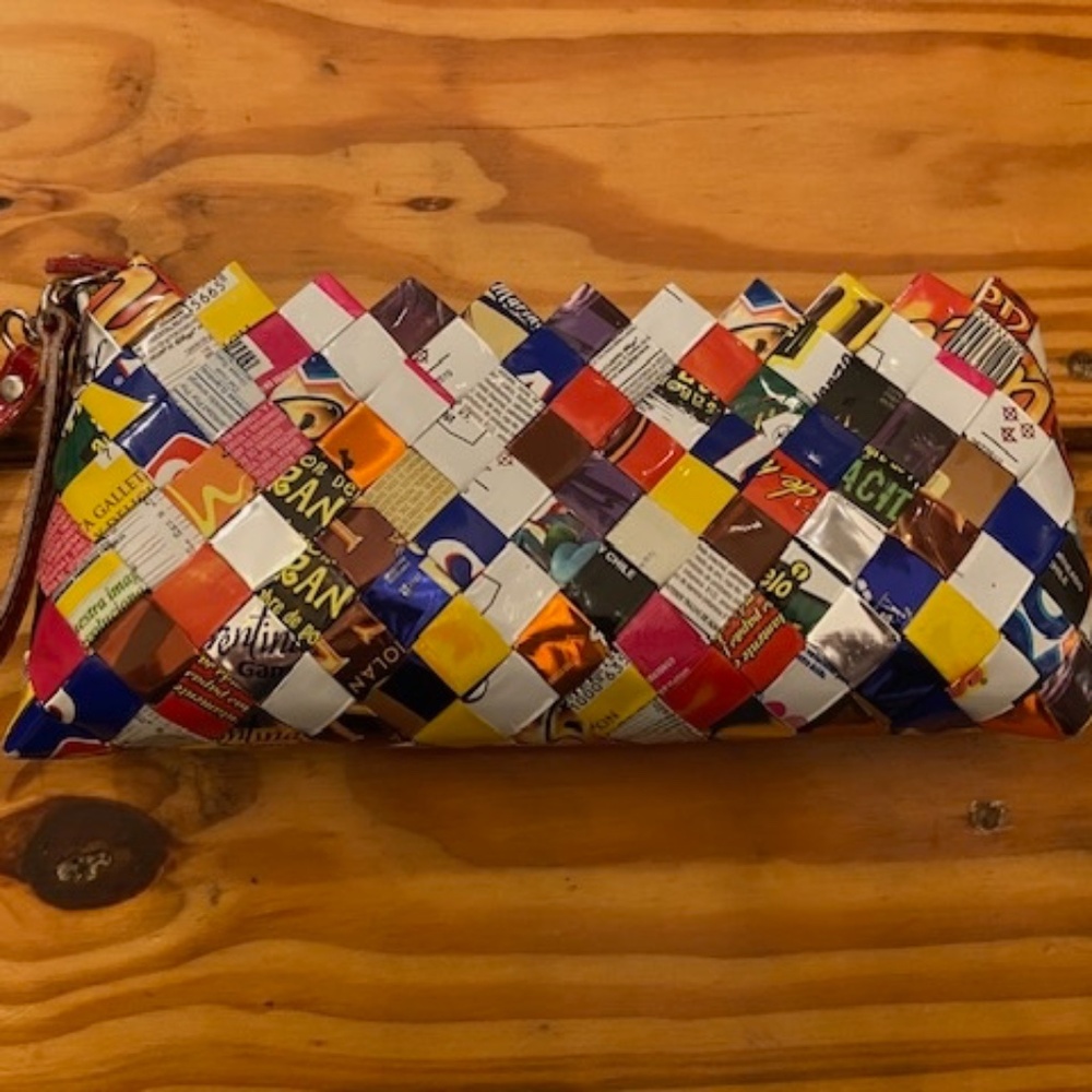 Nahui Ollin Clutch made of candy wrappers. Designer wristlet 9" x 4". Like New